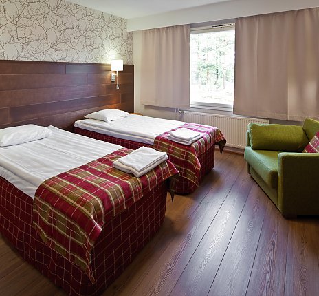 Heimelige Zimmer-Atmosphäre mit Sauna im Hotel Sirkantähti 